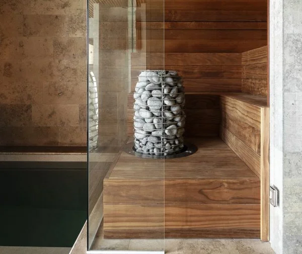 Huum Hive Sauna Heater in a beautiful glass and wood sauna